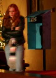 09-standing alone by a broken payphone